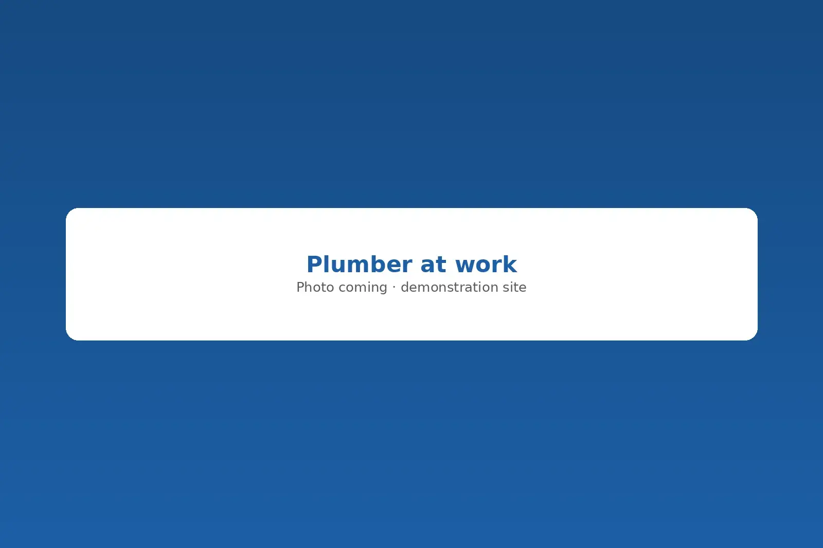 Plumber tightening a supply line under a kitchen sink